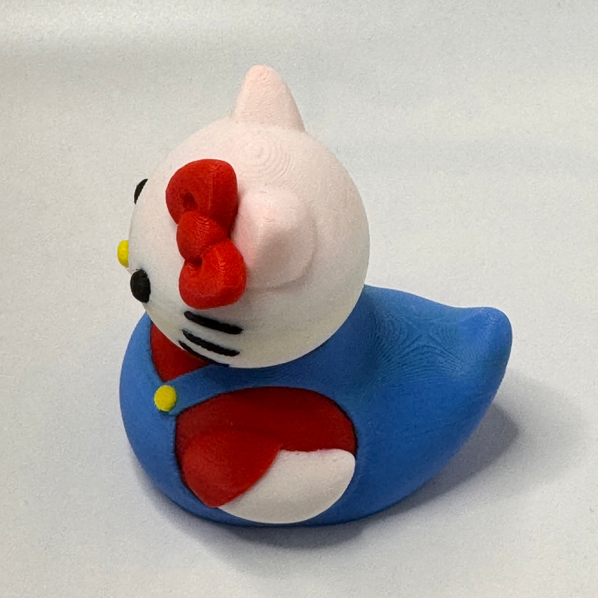 Bow Wearing White Cat Dash Duck - side view