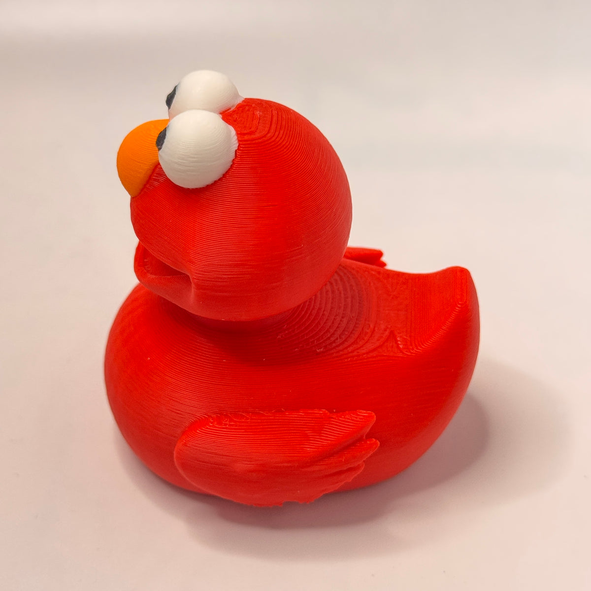 Red Furry Ticklish Monster Dash Duck - side view